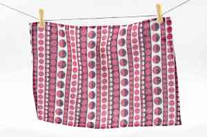 Step 4: You will need sufficient fabric to cover the top of the foot stool plus an inch for turnover. I’ve used a vintage-style tea towel to cover this foot stool.