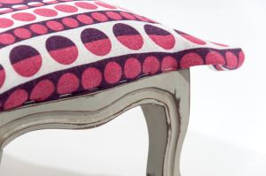 Step 5: Start by stapling each edge in the centre point of the fabric, creating a smooth seam by turning the fabric back on itself by about and inch.