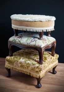 A tower of foot stools. What the foot stool looked like originally.