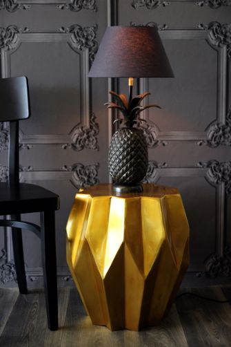 Pineapple lamp on old gold carambola side table. (rockettstgeorge.co.uk)